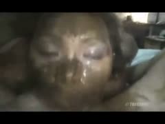 The sultry babe covers her face with her own feces.